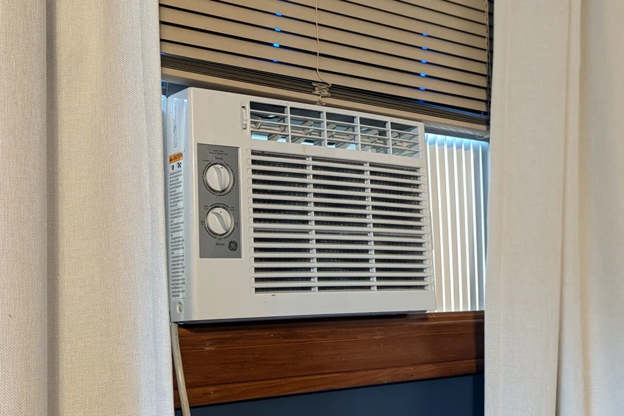 These Two Gadgets Make an Old Window Air Conditioner Smart