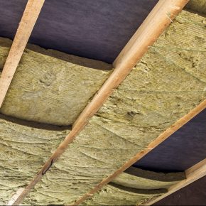 How can insulation help reduce the carbon footprint of a building?